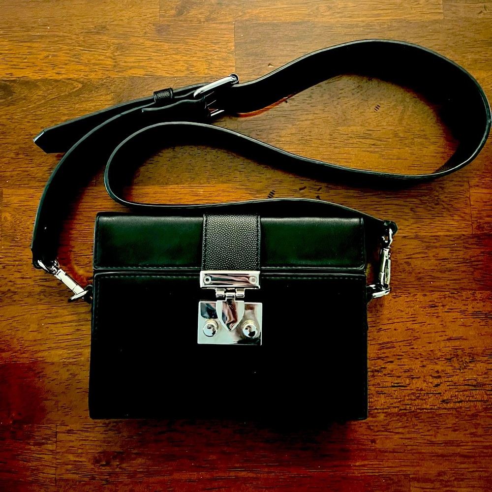 Black purse with silver hardware. Like new.